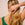Woman with hydrated, healthy hair using ACURE Deep Hydration Hair Care Bundle for moisture repair